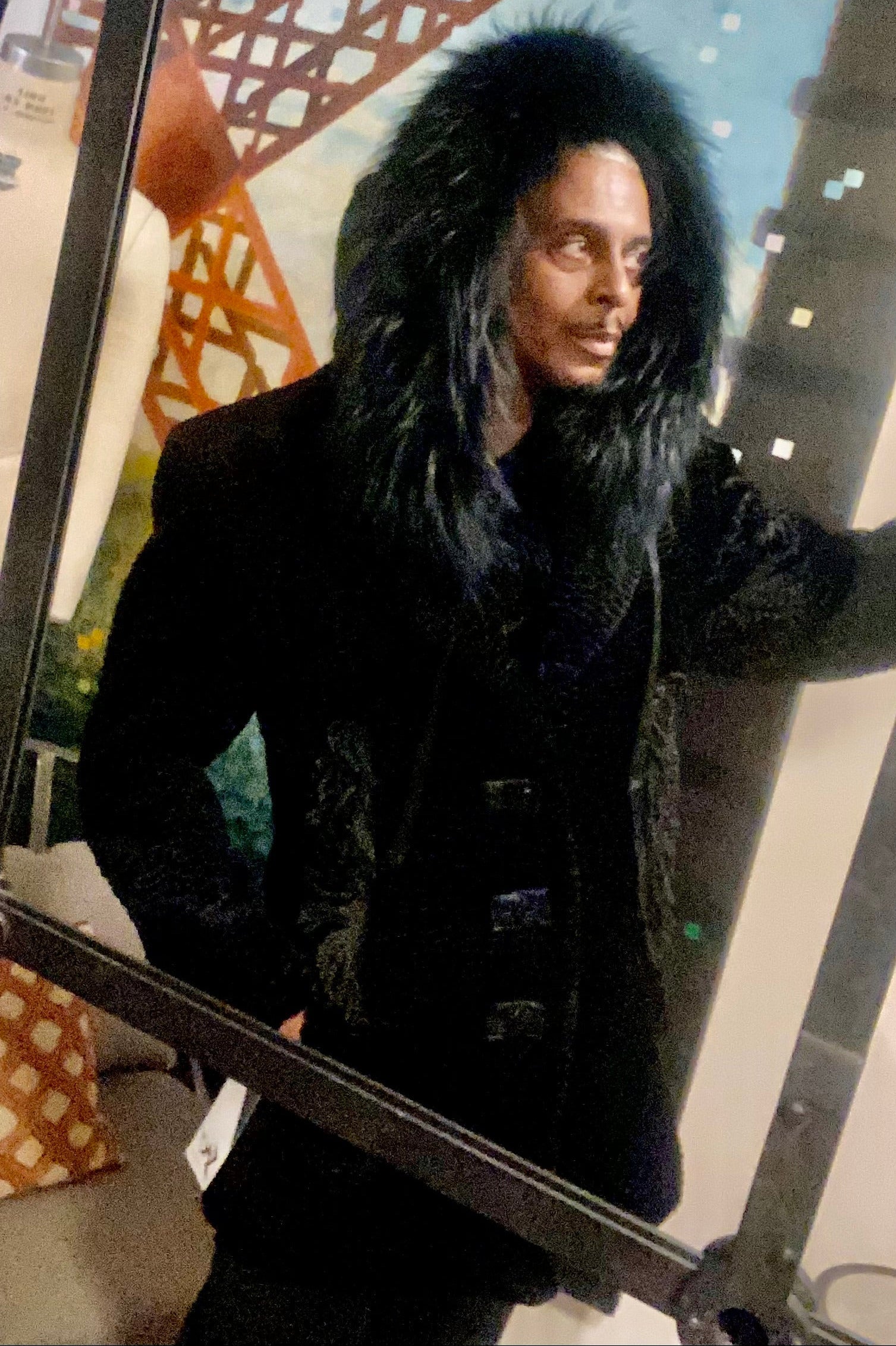 The designer himself, wearing Stacy Couture faux Persian  lamb jacket from Stacy  Couture with bouillon trim and dyed Finnish raccoon removable hood. 