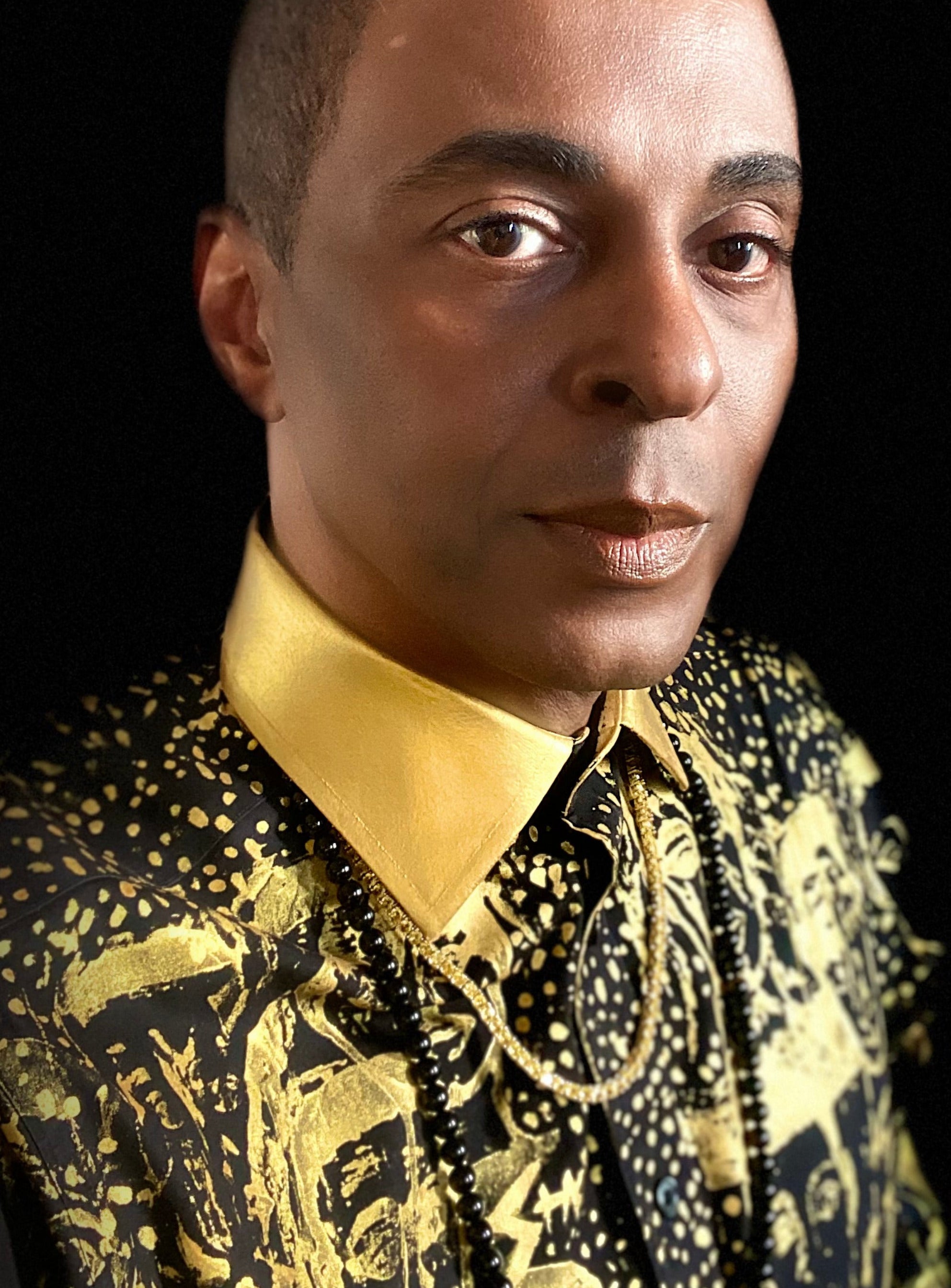 Designer Stacy Stewart /Smith wearing Gold hand painted shirt from Stacy couture Fall 2025 collection.